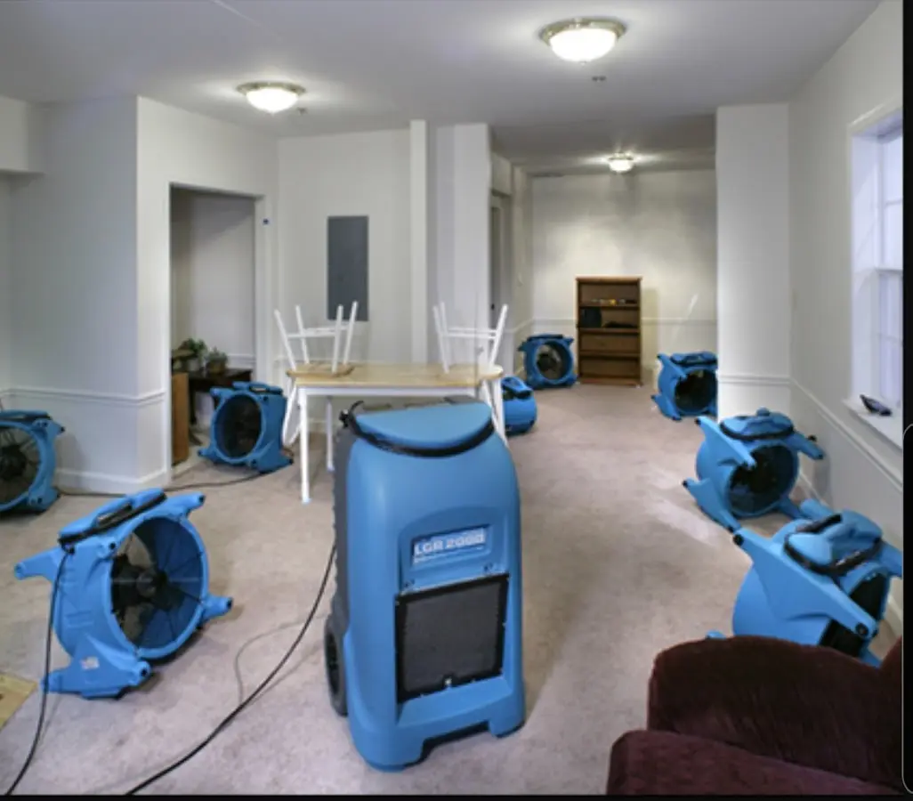 Air movers and dehumidifier setup for Water Damage Restoration in Evans